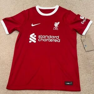 It is a Nike Szoboszlai 8 Liverpool home jersey